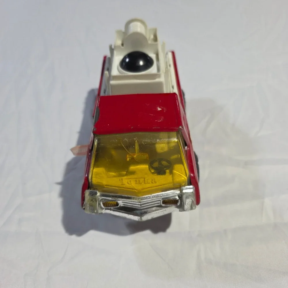 Vintage Red Plastic Fire Truck Toy with Rotating Yellow Ladder and Hose Reel